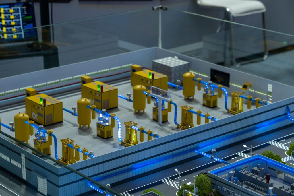 pexels-photo-36522035-36522035 Detailed industrial model display showcasing machinery and systems indoors, emphasizing technology and design.